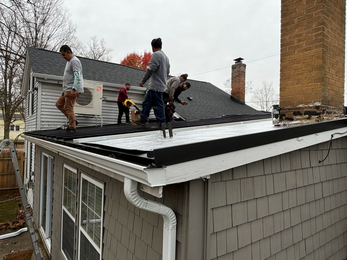 Dice Roofing team working on a roof