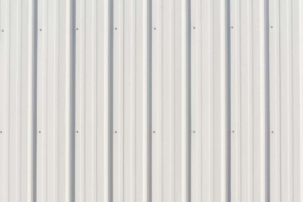 Light gray metal siding with shadows